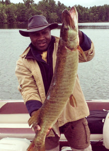 Reckie, the bag guy, holding a 50-inch muskie he caught on Big St. Germain Lake in Wisconsin